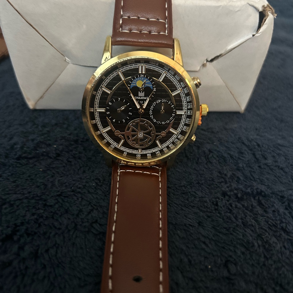 Gold And Brown Watch With Black Dial